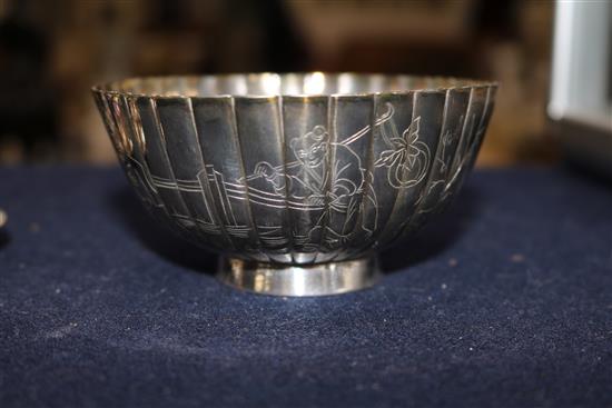 A Chinese silver sugar bowl and two tea strainers.